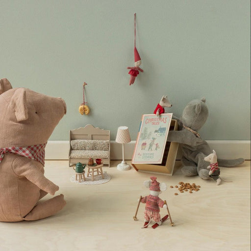 Maileg twin mice reading a Christmas Tales book in a festive playroom scene