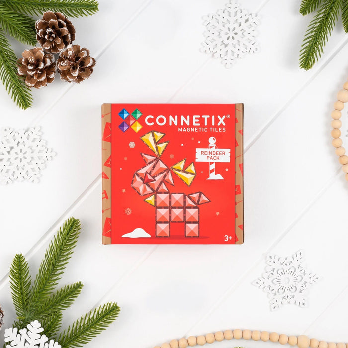 Connetix Christmas Reindeer Pack box among pine branches and snowflakes