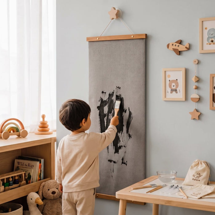 Child painting with water on the Funova water painting canvas hung from a star wall hook in a playroom
